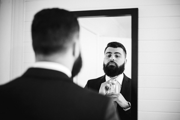 groom in mirror
